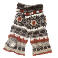 A pair of Dreams Hand Crochet Handwarmers, these wool fingerless gloves showcase geometric patterns in brown, gray, white, and rust with thumb openings and textured layers.