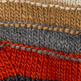 Close-up of Short Cuff Fingerless Gloves, handmade in Nepal, featuring horizontal stripes in cream, tan, gray, orange, and dark gray. Wool yarn texture and individual stitches are clearly visible.