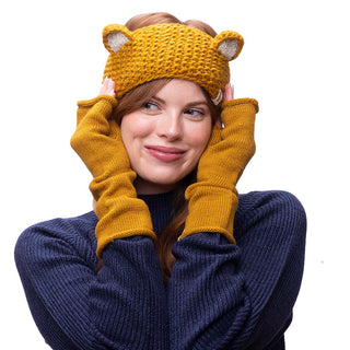 A woman wearing a wool knitted hat and Forever Long handwarmers.