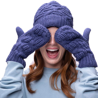 A woman covering her eyes with Side Cable Knit mittens.
