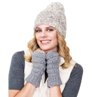 A smiling woman wearing Starry handwarmers and a knitted hat.