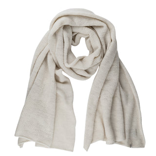 The Hand Loom Air Wrap Scarf, in cream, is hand-knit and displayed flat on a white background. It looks soft, lightweight, and slightly textured with both ends shown.