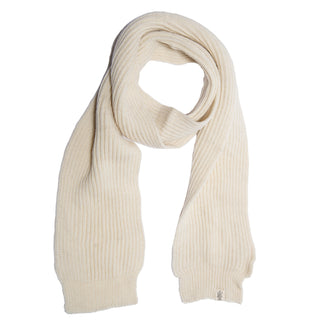 A cream-colored, ribbed knit Hand Loom Laurent Scarf, handmade in Nepal from merino wool, is laid flat on a white background with one end looped over the other.