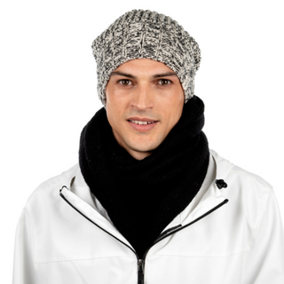 A man wearing a white jacket with a black scarf and a gray, Union Slouch knitted hat with pom.