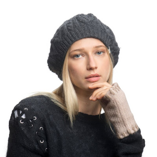 A blonde woman wearing a Yves Saint Laurent Beret and gloves.