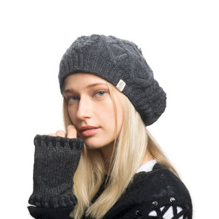 A blonde woman wearing a Yves Beret and merino wool gloves.
