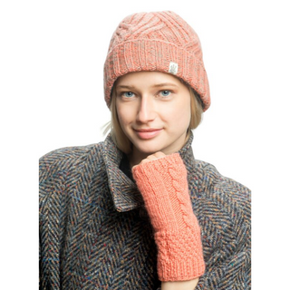 A young woman wearing a Journey Rib Fold Beanie and gloves.