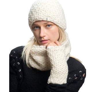 A woman with blonde hair wearing a white I See Stars Merino Beanie with Pom Pom and matching scarf, posing against a white background.