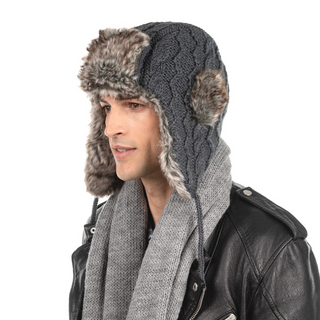 A man wearing a Cable Knit Russian Hat w/ Faux Fur and scarf.