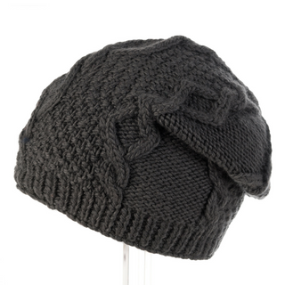 A handmade black knit wool Sectional Slouch hat on a stand.