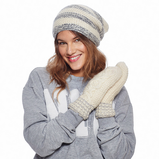 A woman wearing a Soft Stripe Slouch hat and mittens.