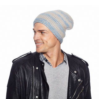 A man wearing a Soft Stripe Slouch, blue and white striped merino wool slouch hat.