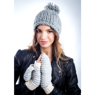 A woman wearing a Chunky Beanie w/ Pom and hand-made gloves.