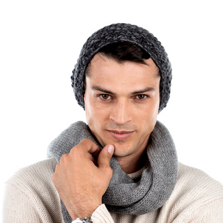 A man wearing a Marich Pattern Long Pull On Cap and scarf with a marich pattern on a white background.