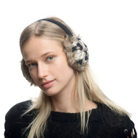 A young woman with long blonde hair wears Hand Crochet Kaleidoscope Earmuffs with an adjustable band and a black sweater. She is facing forward and looking slightly to the side against a plain white background.
