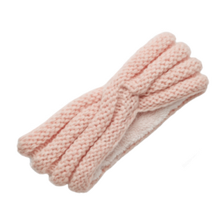 A pink, handmade knitted Veronica Headband on a white background.
