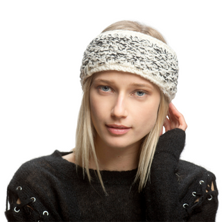 A woman wearing a merino wool Aurora Headband.