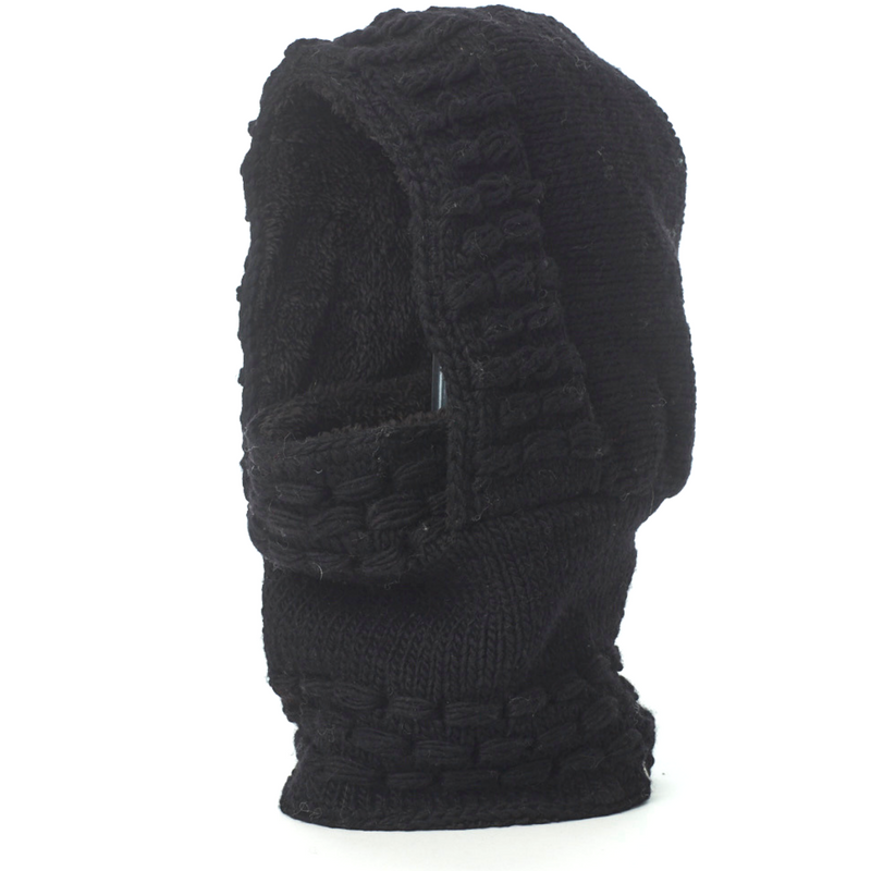 The Hand Knit Legends Hood, a unisex merino wool balaclava featuring a textured, woven pattern in black, is displayed upright against a plain white background.