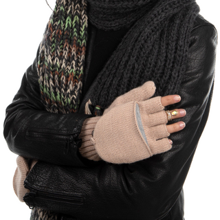 A woman wearing a scarf and Bryant Fingerless Gloves with Flap showcases her natural ingredients-based skincare routine.