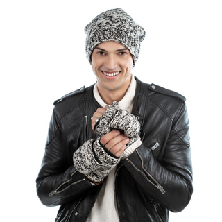 A smiling young man wearing a black leather jacket, a knit beanie, and Bedford Fingerless Gloves with flap made of wool against a white background.