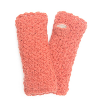 A pair of I See Stars Merino Handwarmers, coral pink knitted mittens handmade in Nepal isolated on a white background.