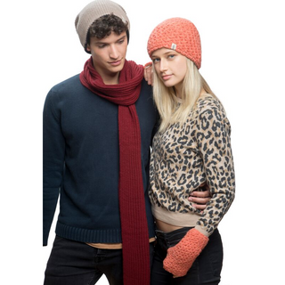 A man and a woman wearing winter accessories, including beanies, I See Stars Merino Handknit Handwarmers, and a scarf, posing against a white background.