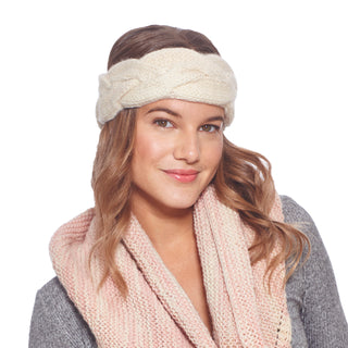 A woman wearing a pink scarf and a Braided Headband.