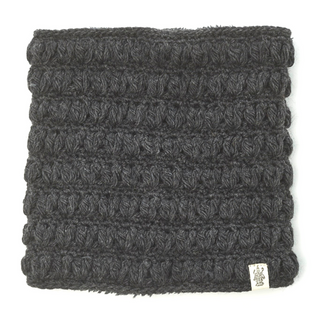 A dark gray Good Vibes Neckwarmer with a visible tag lying flat on a light background.
