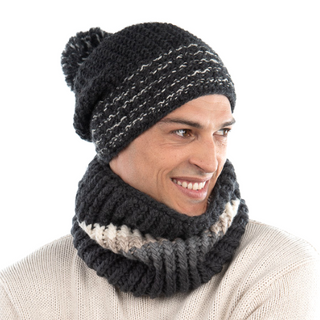 Man wearing a knitted hat and a Hi Fidelity Neckwarmer, smiling off to the side.
