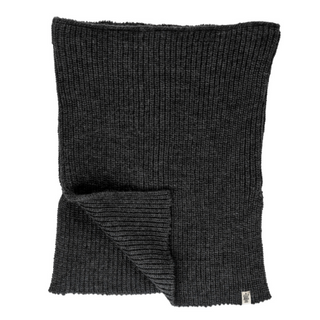A flat-laid black knitted Mick Neckwarmer with a ribbed pattern and a small tag on the edge, handmade in Nepal from merino wool.