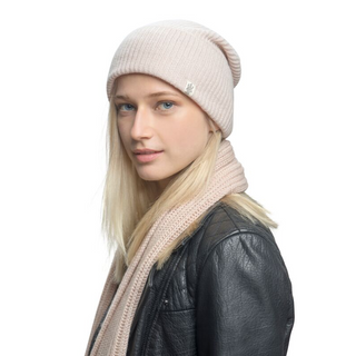 A blonde woman wearing a beanie and a Cashmere Laurent Scarf made of merino wool.