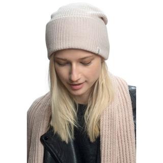 A blonde woman wearing a beanie and a handmade Laurent Scarf.