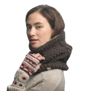 A woman with a side glance, wearing a Margins Neckwarmer with sherpa fleece lining and a sweater with patterned sleeves.