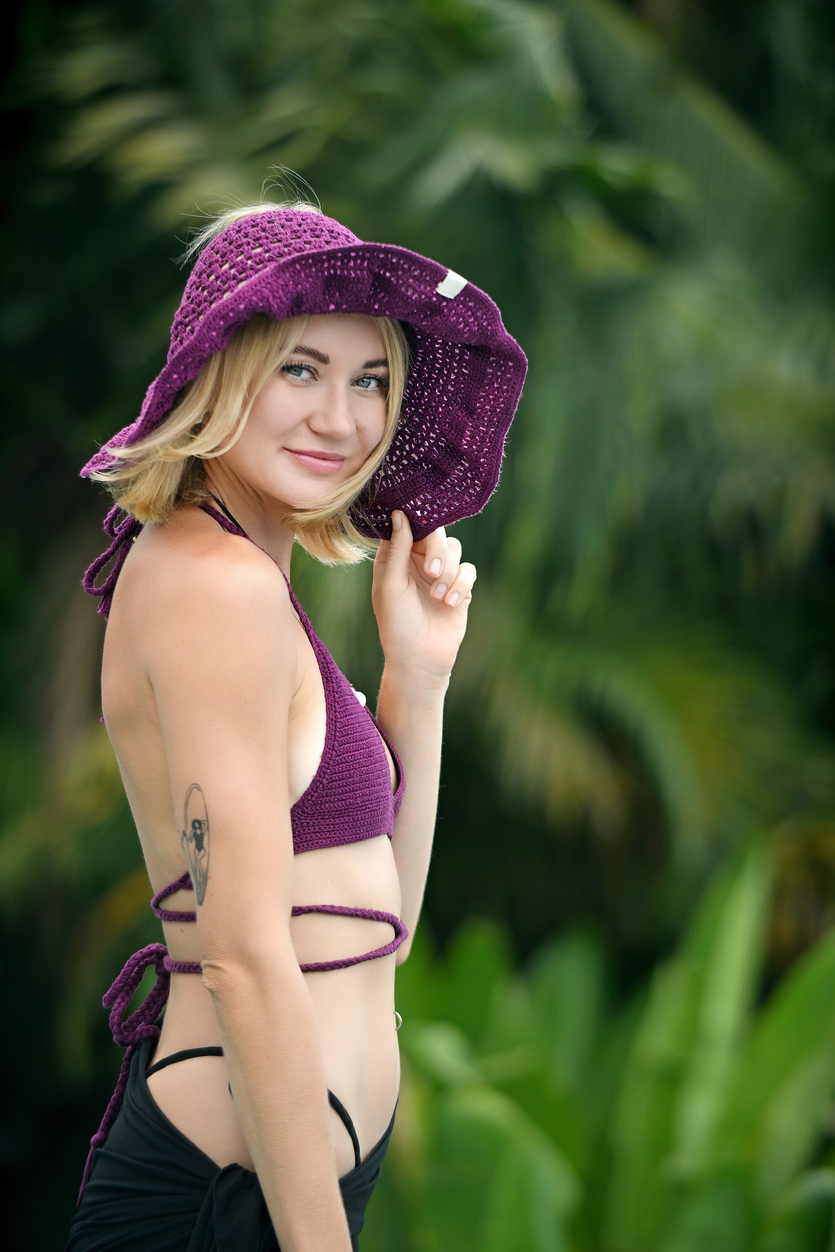 Hand-crocheted cotton swim and sun hats, worn at the beach