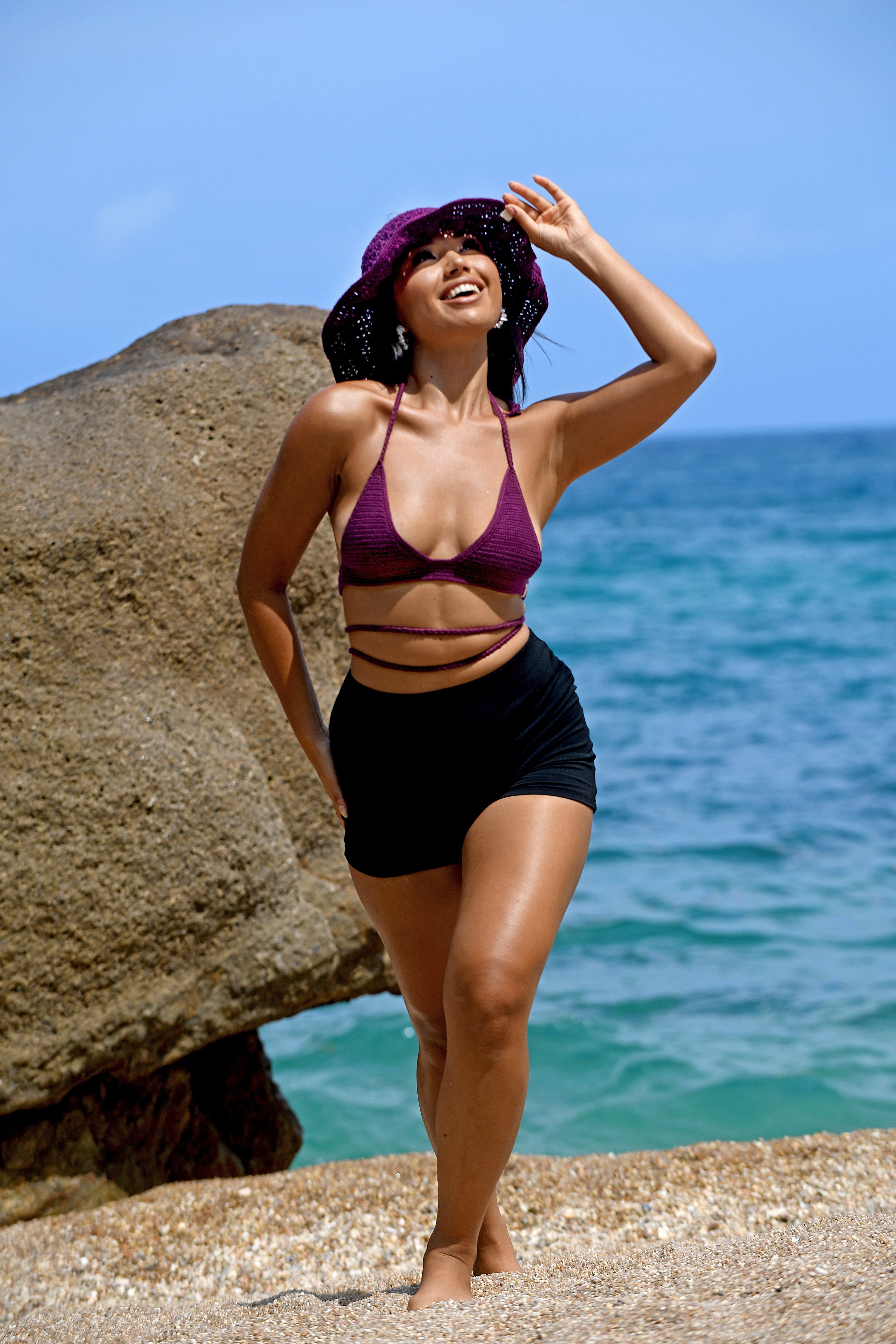 Hand-crocheted cotton swim and sun hats, worn at the beach