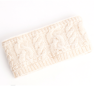 A cream-colored wool Carousel Headband with Rib, displayed on a white background. Handmade in Nepal.