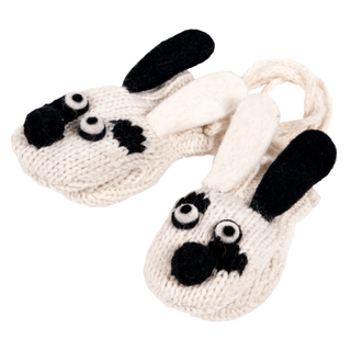 A pair of Nepal hand-made, cream-colored, knitted slippers designed to look like cartoonish dogs with black and white details, featuring floppy ears and prominent eyes.