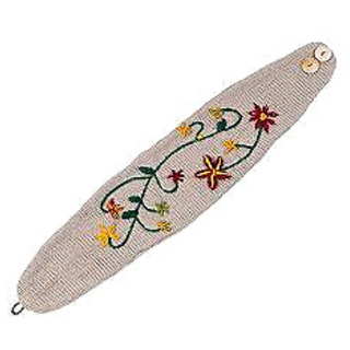Embroidered headband with buttons with floral design on a beige background, fleece lined and handmade in Nepal.
