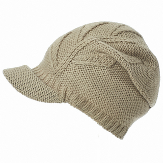 A beige Life Slouch Cap with a ribbed brim and cable knit patterns, handmade in Nepal.