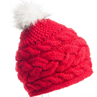 A red Shangri-La cap with a white faux fur pom.