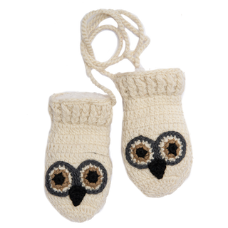 Two Crochet Owl Mittens on a white surface.