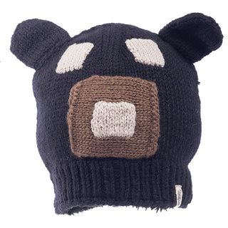 A knitted navy blue Square Bear Hat- BLACK with bear ear details, a beige and white face pattern on the front, and Sherpa lining.