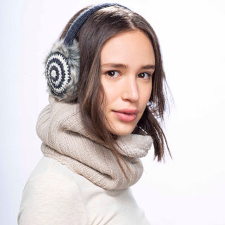 A woman wearing a scarf and Spiral Earmuffs to stay warm.