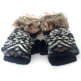 A pair of Opposite Pattern Fingerless Gloves w/ Flap with faux fur cuff, laying on a white surface.
