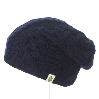 A navy blue Oslo Braid Knit Slouch hat displayed against a white background.