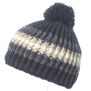 A Hi Fidelity Beanie w/ Pom handmade in Nepal, featuring gradient shades from black to cream against a white background.