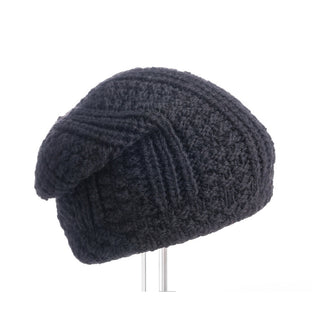 A black Caliber Slouch knit hat on a stand.